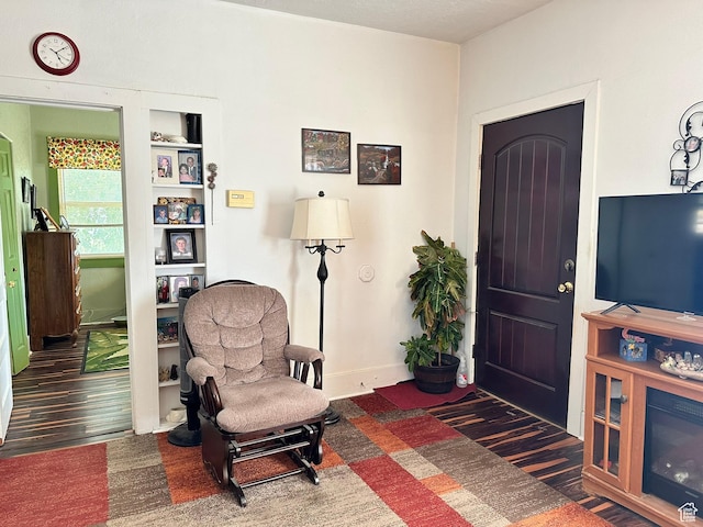 foyer with wood finished floors and baseboards