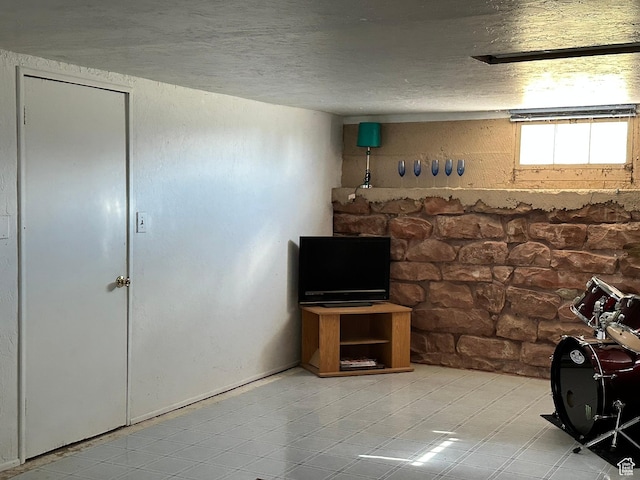 unfurnished living room featuring a textured ceiling