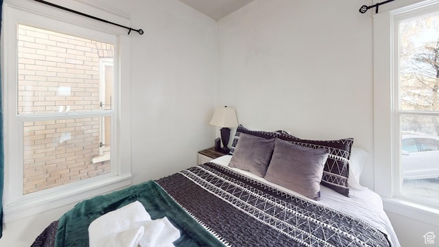 bedroom featuring multiple windows