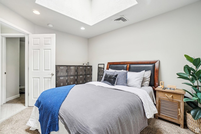 bedroom featuring carpet floors, a skylight, recessed lighting, and vaulted ceiling