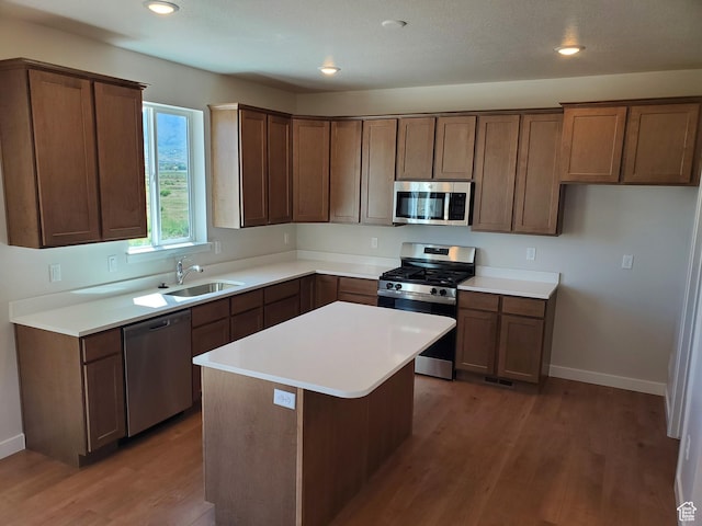 1186 N 1525 E Unit Arsf99, Payson, UT 84651 - kitchen featuring stainless steel appliances, wood finished floors, a sink, baseboards, and light countertops