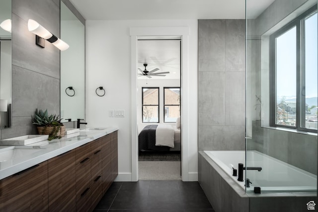 full bath with healthy amount of natural light, a ceiling fan, ensuite bathroom, and tile patterned flooring