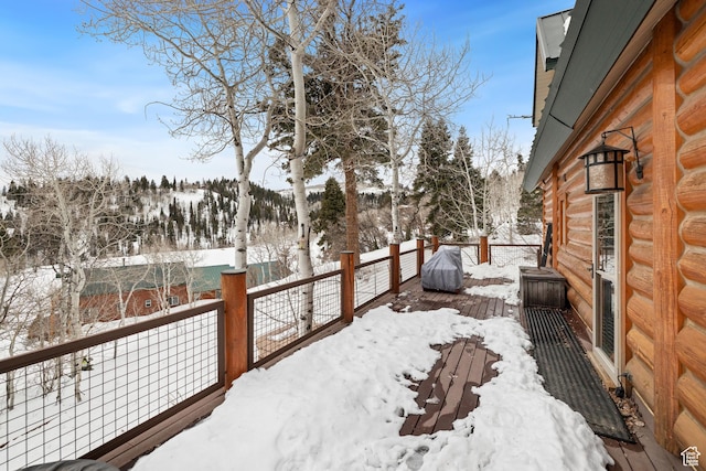 view of snow covered deck