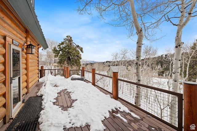 yard covered in snow featuring a mountain view