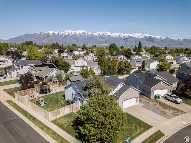 aerial view of residential area featuring mountains