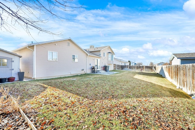 back of house with cooling unit and a patio area