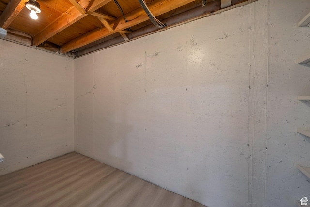 unfinished basement featuring wood finished floors