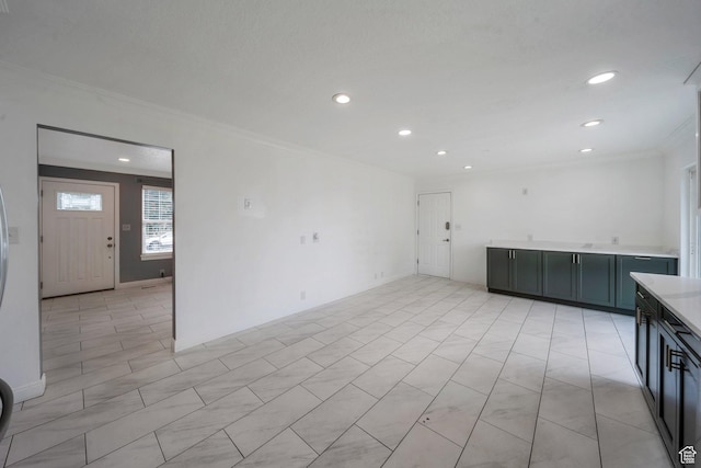 spare room featuring crown molding and recessed lighting