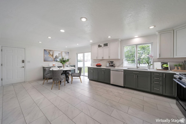 665 E Howard Dr, Sandy, UT 84070 - kitchen with appliances with stainless steel finishes, light countertops, recessed lighting, white cabinetry, and a textured ceiling