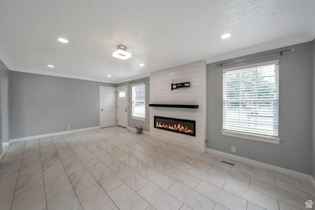 unfurnished living room featuring ornamental molding, baseboards, a fireplace, and recessed lighting