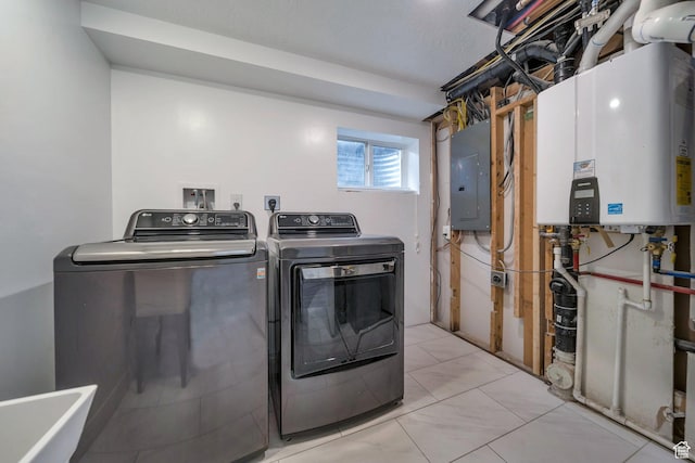 washroom with separate washer and dryer, electric panel, and water heater