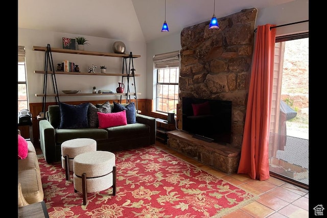 88 Stone Mountain Rd Unit 104B, Springdale, UT 84767 - living room featuring lofted ceiling, tile patterned floors, and a wainscoted wall
