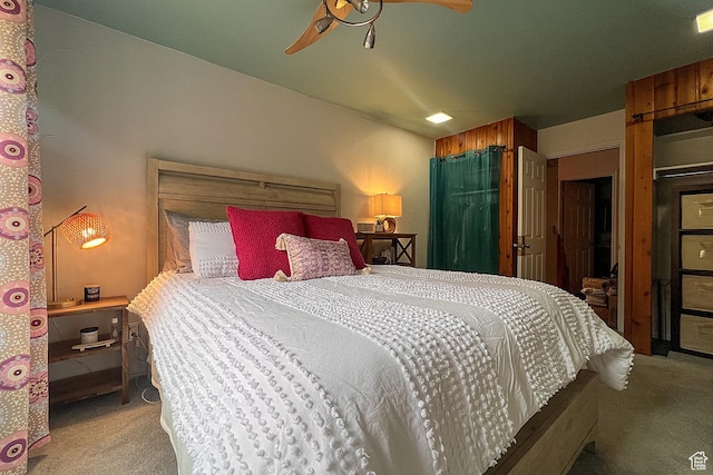 carpeted bedroom featuring a ceiling fan