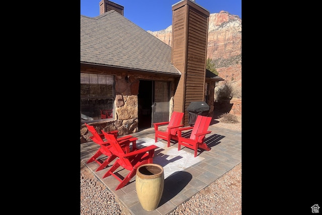 view of patio featuring a grill