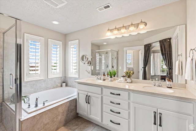 5153 W Bowstring Way S, Jordan, UT 84009 - full bath with a stall shower, a garden tub, double vanity, a textured ceiling, and tile patterned floors