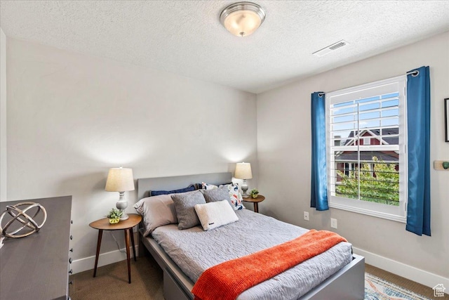 5153 W Bowstring Way S, Jordan, UT 84009 - bedroom featuring baseboards, a textured ceiling, and carpet flooring