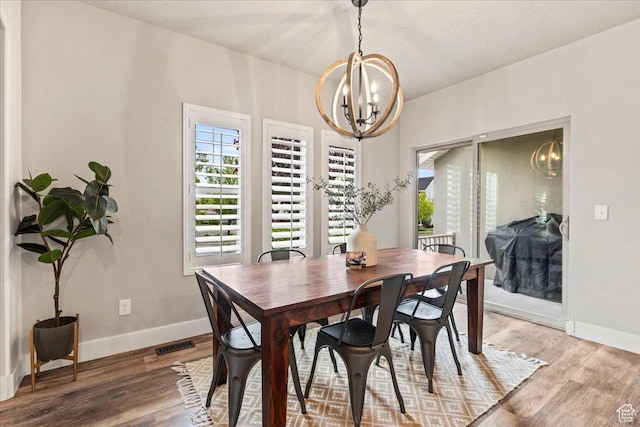 5153 W Bowstring Way S, Jordan, UT 84009 - dining space with a chandelier, baseboards, and light wood-type flooring