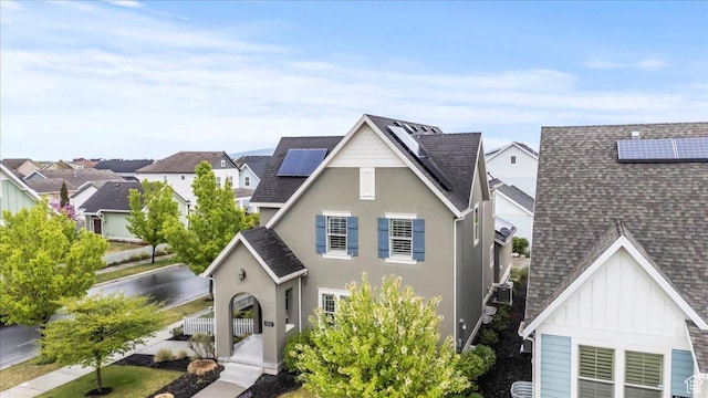 5153 W Bowstring Way S, Jordan, UT 84009 - traditional-style home featuring solar panels, roof with shingles, and a residential view