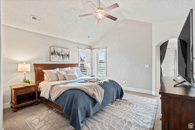 5153 W Bowstring Way S, Jordan, UT 84009 - bedroom featuring light carpet, lofted ceiling, arched walkways, baseboards, and a textured ceiling
