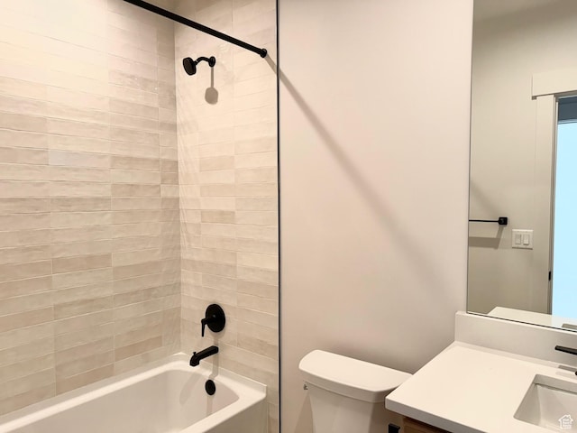 bathroom featuring toilet, shower / washtub combination, and vanity