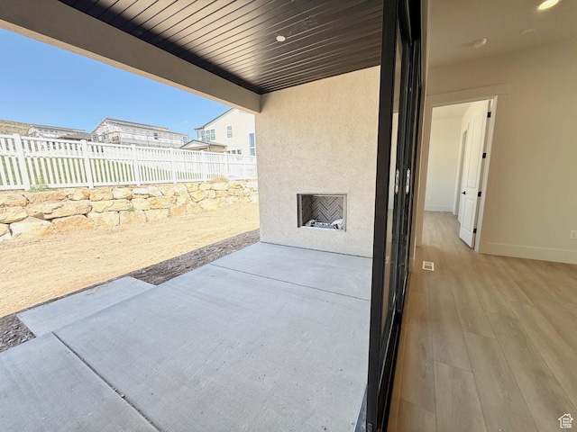 view of patio / terrace featuring fence