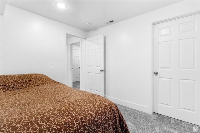 carpeted bedroom featuring baseboards and recessed lighting