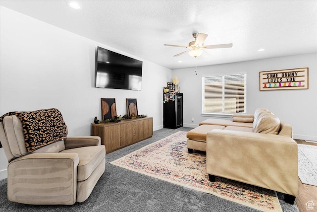 carpeted living area featuring ceiling fan, baseboards, and recessed lighting