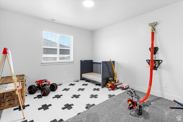 carpeted bedroom featuring baseboards