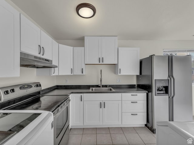kitchen with stainless steel appliances, under cabinet range hood, a sink, white cabinetry, and light tile patterned floors