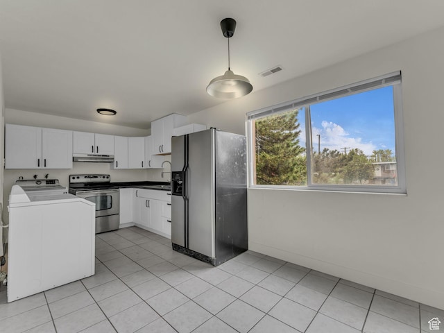 kitchen with refrigerator with ice dispenser, stainless steel electric range, washer / clothes dryer, and white cabinetry