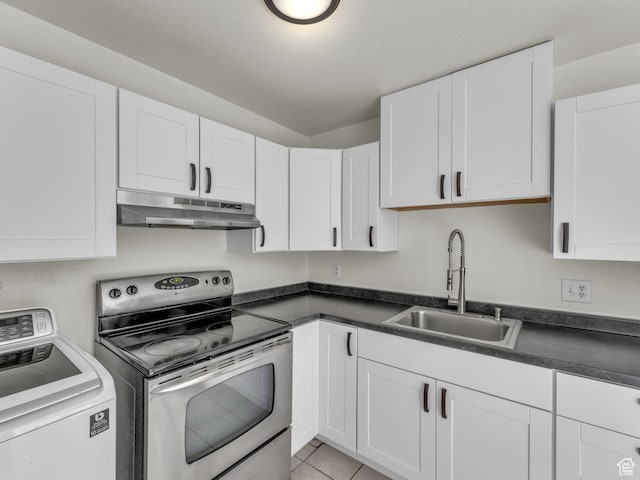 kitchen featuring washer / dryer, under cabinet range hood, a sink, stainless steel range with electric cooktop, and dark countertops
