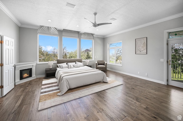 90 S Sherwood Dr, Providence, UT 84332 - bedroom featuring a textured ceiling, dark wood-style flooring, access to exterior, baseboards, and crown molding
