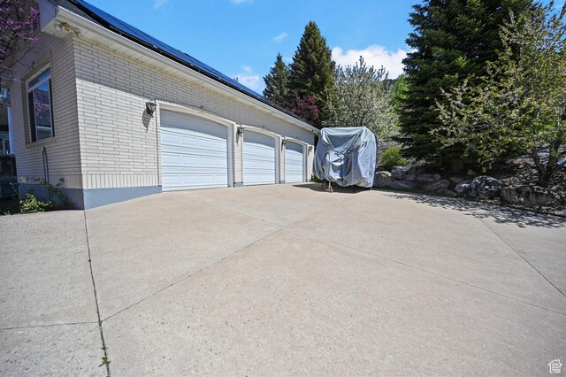 90 S Sherwood Dr, Providence, UT 84332 - garage featuring concrete driveway