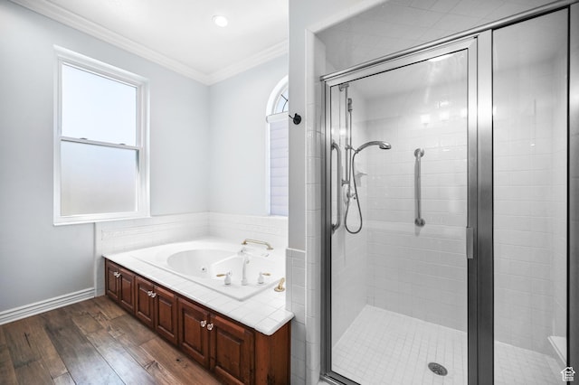 90 S Sherwood Dr, Providence, UT 84332 - full bath featuring wood finished floors, a stall shower, a jetted tub, ornamental molding, and baseboards