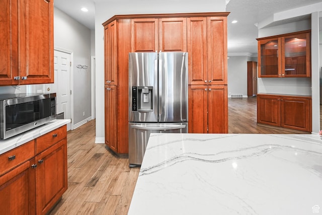 90 S Sherwood Dr, Providence, UT 84332 - kitchen featuring appliances with stainless steel finishes, recessed lighting, baseboards, light wood finished floors, and light stone counters
