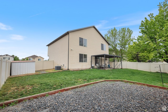 back of house with central AC and a patio area