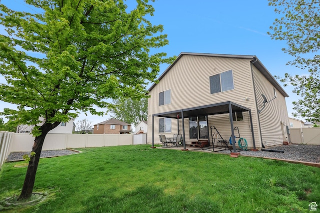 back of property with a patio and a gate