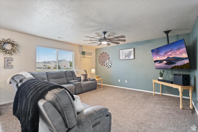 living room with a textured ceiling, a ceiling fan, carpet, and baseboards