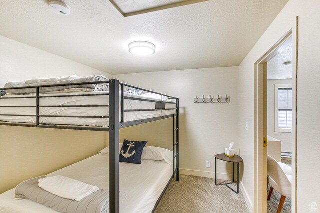 40 N Christa Cir, Garden City, UT 84028 - carpeted bedroom with baseboards and a textured ceiling