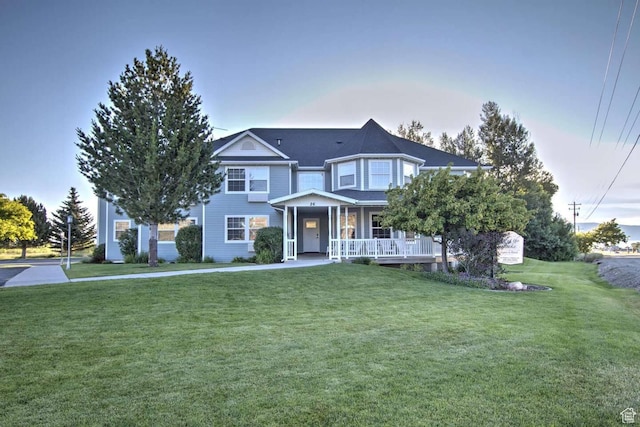 40 N Christa Cir, Garden City, UT 84028 - victorian house featuring covered porch and a front lawn