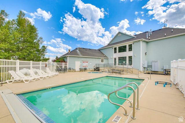 40 N Christa Cir, Garden City, UT 84028 - community pool featuring a patio and fence