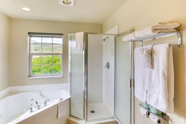 40 N Christa Cir, Garden City, UT 84028 - bathroom featuring a stall shower and a bath