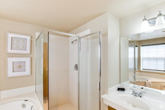 40 N Christa Cir, Garden City, UT 84028 - full bath with a sink, a shower stall, and a garden tub