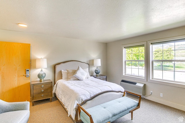 40 N Christa Cir, Garden City, UT 84028 - bedroom with a wall unit AC, light colored carpet, a textured ceiling, and baseboards
