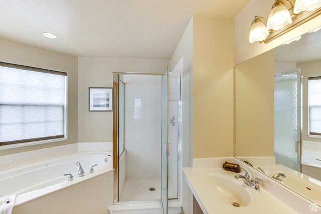 40 N Christa Cir, Garden City, UT 84028 - full bathroom with a garden tub, a shower stall, and vanity