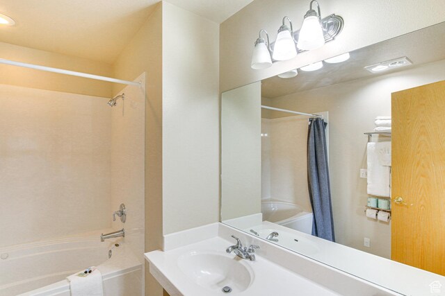 40 N Christa Cir, Garden City, UT 84028 - bathroom with shower / tub combo with curtain and vanity