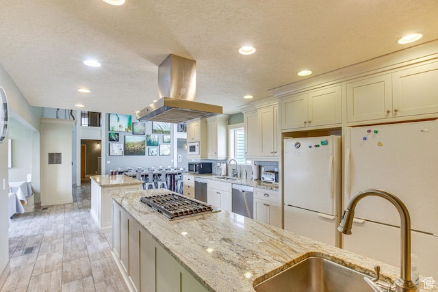 40 N Christa Cir, Garden City, UT 84028 - kitchen featuring stainless steel appliances, island range hood, a kitchen island, a sink, and a textured ceiling