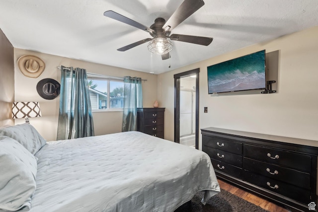 bedroom with dark wood-type flooring and ceiling fan