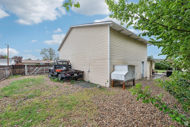 view of side of property with fence
