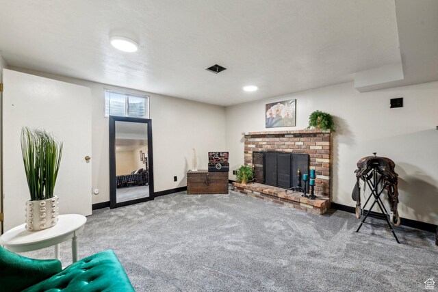 carpeted living area with baseboards and a fireplace